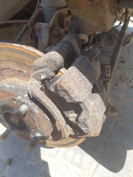 Гальмівний супорт задній лівий Mazda 323  1999 хетчбек 2.0 Бензин 