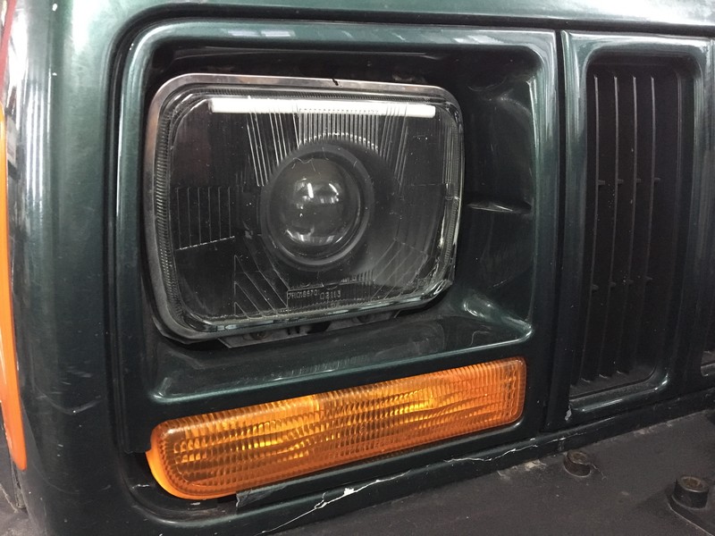 Окуляр фары левый Jeep Cherokee XJ  1998 2.5 Дизель Киев
