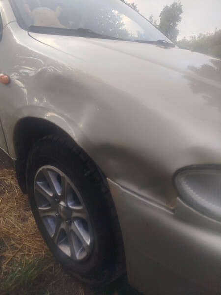 Крило переднє Mazda 323  1996  Электро 