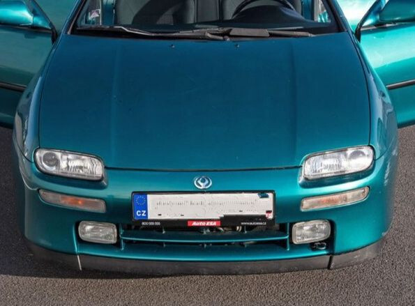 Бампер передний Mazda 323 хэтчбек 1997 г.  1.5 л бензин