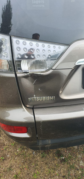 Левый фонарь в крышку багажника Mitsubishi Outlander XL  2009 2.4 Бензин Киев