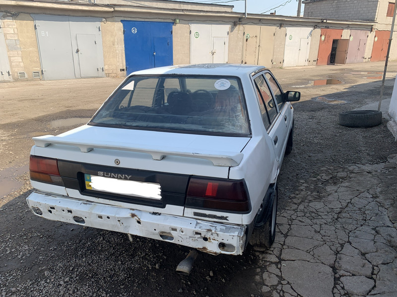 Бампер задній Nissan Sunny  1990 1.7 Дизель 